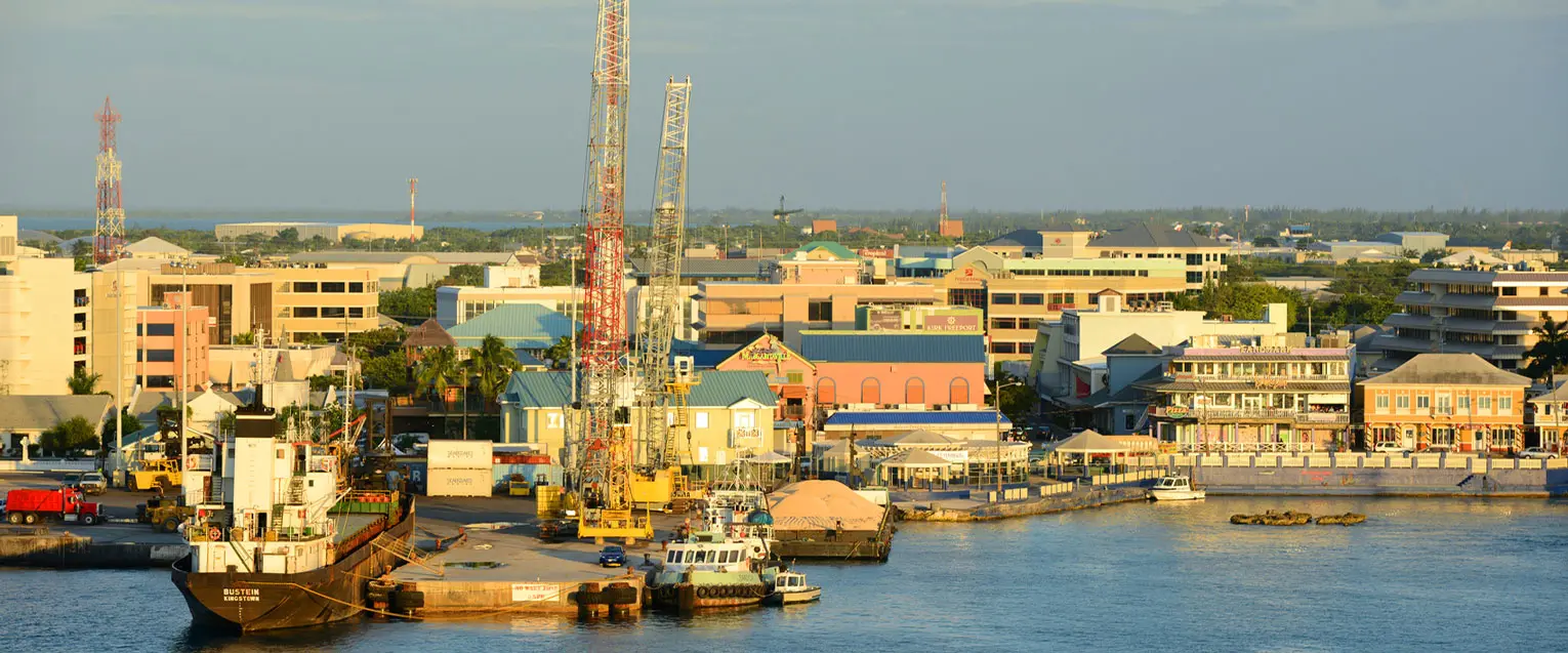 View of George Town harbor with colorful buildings and calm turquoise waters